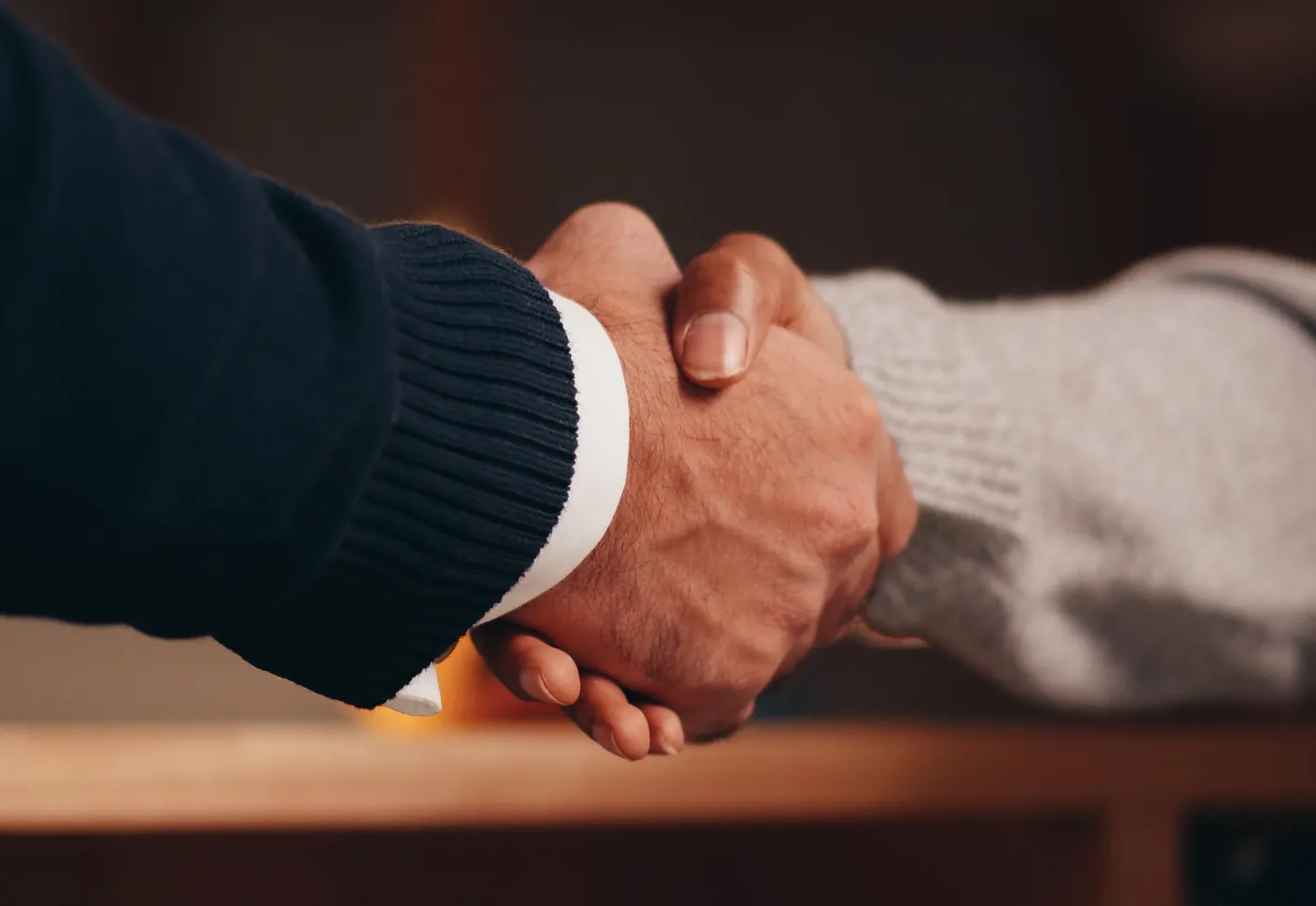 A professional handshake representing Scribetech healthcare partnerships
