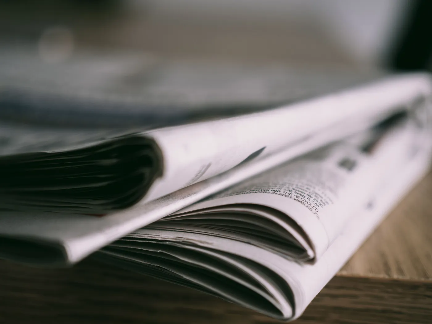 Folded newspapers representing Scribetech news and press releases