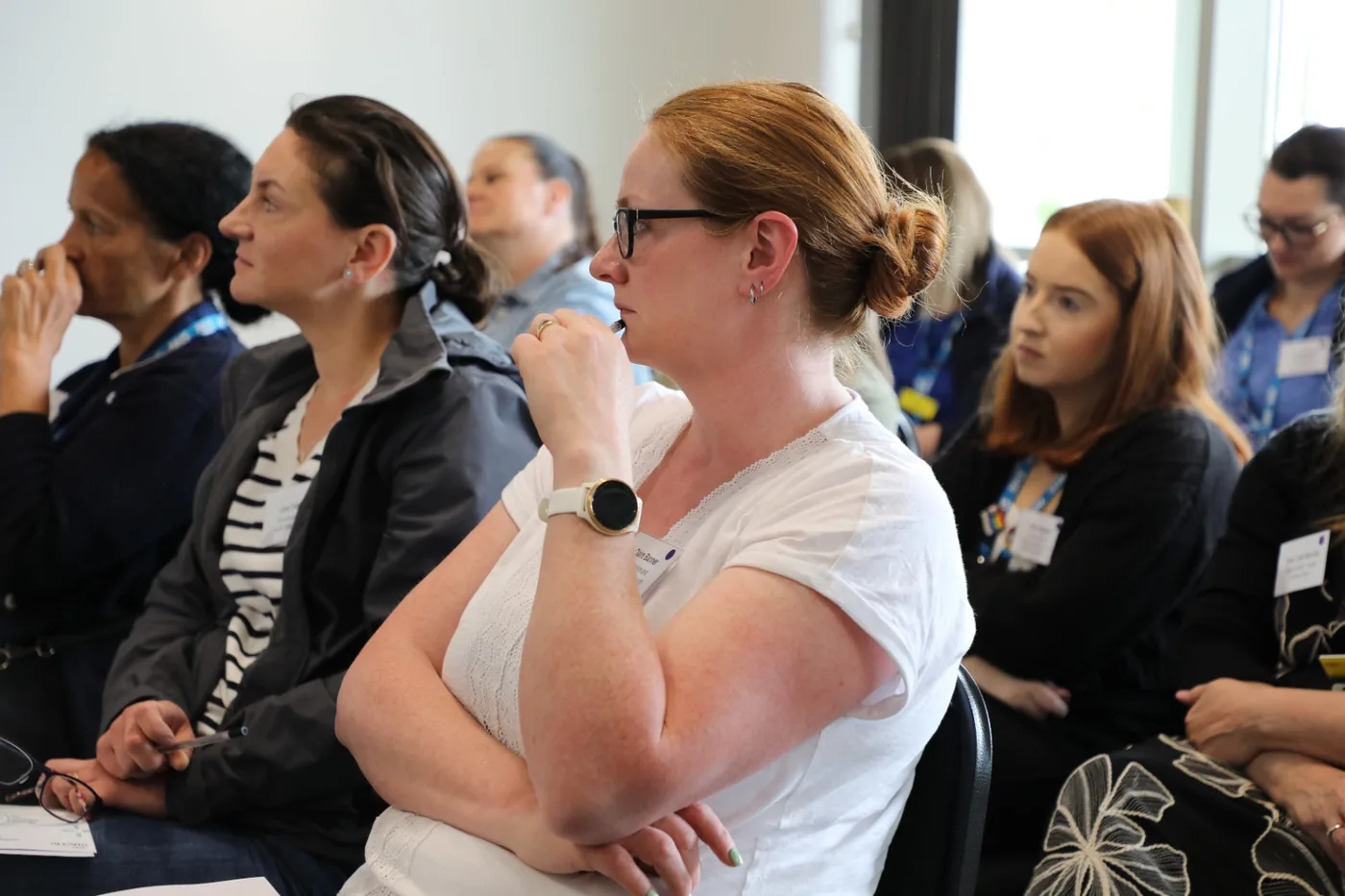 Healthcare professionals attending a clinical technology presentation